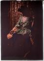 [Actress in green tunic and blue tights, with dagger]
