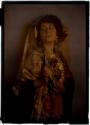 [Woman in lace mantilla holding fan]