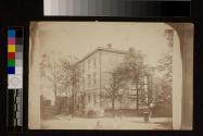[Street scene with three-story house Greek Revival house (from the rear)]