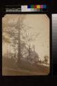 [Fieldstone house on hill, two men on path]