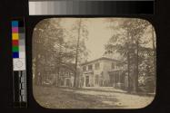 [Suburban fieldstone house with side porch]