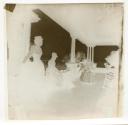 [Group of young women on wide front porch]