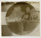 [James G. Averell holding puppy]