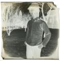 [Person in shirtsleeves in the snow, 11 Prince St. Rochester NY, winter]