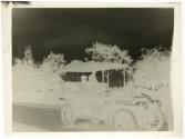 [Two people in touring car with chauffeur]