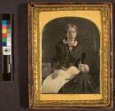 [Woman holding sleeping or dead infant]