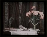 [Still life with silver slipper, flowers and statuette]