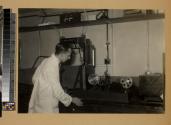 Technician working with cine camera in laboratory