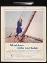 Advertisement for Kodak and Brownie Cameras featuring the Kodak Girl