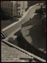 [Street scene from tiled roof]