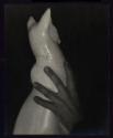 [Hand on porcelain cat]
