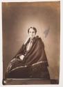 [Elderly woman in lacy bonnet, seated, wrapped in a shawl]