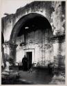 [Father O'Keefe in front of the San Juan Capistrano Mission, California]