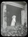 Woman on porch stairway