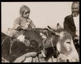 A Tiny Turkish Refugee. This little girl. was lucky; her father was too old to go to war, and was rich enough to own a donkey.