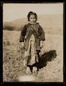 Bralo, Greece. Shepherdess. Ioula, little goat-girl on the grassy slopes near Bralo, Greece. Behind her is Mt. Parnassus.