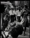 [People watching an artist sketching on the street, Greenwich Village]