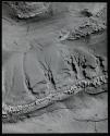 [Cracks in dried river mud]