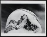 [Conglemeratic rock rounded by the effects of water]