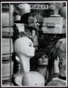 [Wig shop exhibits in store window, New York]