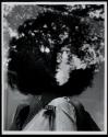 [Mannequin in afro wig]