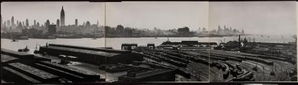 [New Jersey harbor sheds. Empire State building on the opposite side of the Hudson.]