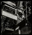 [Gunsmith advertising sign near central police headquarters on Grand Street]