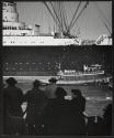 [Arrival of the Queen Mary, largest passenger liner of her day]