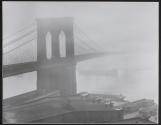 [Brooklyn Bridge on a foggy day, seen from the Brooklyn side]