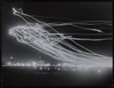 Landing lights of incoming planes, LaGuardia airfield
