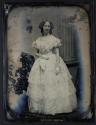 [Woman in gown]