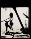 [Worker with hoisting ball]