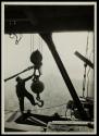 [Worker with hoisting ball]