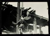 [Man on hoisting ball]