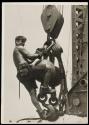 [Man on hoisting ball, Empire State Building]