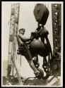 [Man on hoisting ball, Empire State Building]