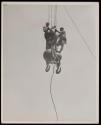 [Two men on hoisting ball, Empire State Building]