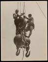 [Two men on hoisting ball, Empire State Building]