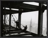 [Workers on girder, Empire State Building construction]