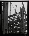 [Worker on cable, Empire State Building construction]