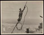[Worker on cable, Empire State Building construction]