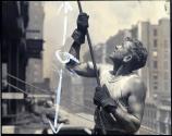 [Worker guiding a beam, Empire State Building construction]