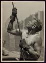 [Worker guiding a beam, Empire State Building construction]