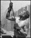 [Worker guiding a beam, Empire State Building construction]