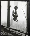 [Man on hoisting ball, Empire State Building]