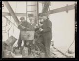 [Workers eating lunch by rivet forges, Empire State Building]