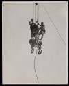 [Two men on hoisting ball, Empire State Building]