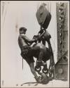 [Man on hoisting ball, Empire State Building]