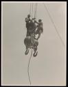 [Two men on hoisting ball, Empire State Building]