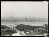 [View of city from across river]